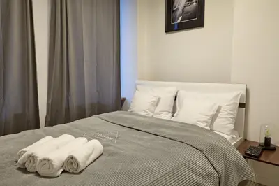 Łóżko lub łóżka w pokoju w obiekcie oompH Warsaw Central Premium Apartments