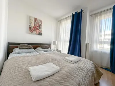 Łóżko lub łóżka w pokoju w obiekcie Warsaw Inside Apartments