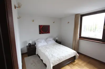 Łóżko lub łóżka w pokoju w obiekcie Apartment Nowiniarska near the Old Town