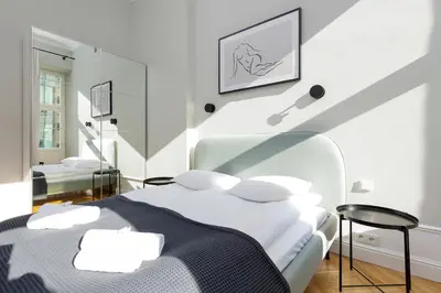 Łóżko lub łóżka w pokoju w obiekcie Apartment Warsaw Boduena by Renters Prestige