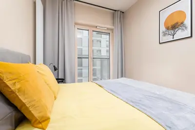 Łóżko lub łóżka w pokoju w obiekcie BG Premium Apartments Mennica Residence