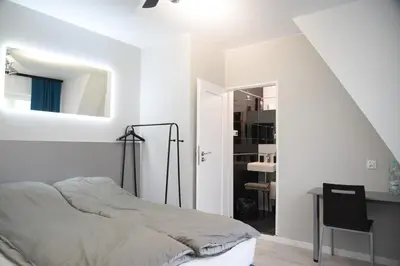 Łóżko lub łóżka w pokoju w obiekcie KOMFORT WILLA Plus
