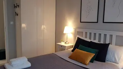 Łóżko lub łóżka w pokoju w obiekcie Grochowska Apartment