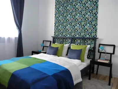 Łóżko lub łóżka w pokoju w obiekcie Apartament Metro Kowieńska