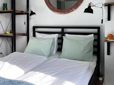 Łóżko lub łóżka w pokoju w obiekcie Apartament Metro Działdowska