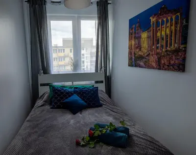 Łóżko lub łóżka w pokoju w obiekcie Apartament Marta