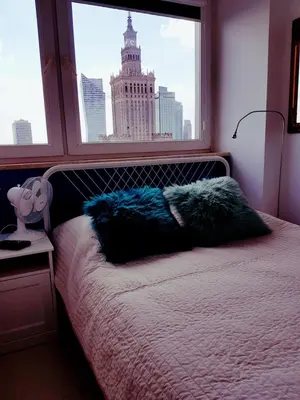 Łóżko lub łóżka w pokoju w obiekcie Centre Apartamenty Warszawa