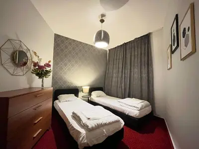 Łóżko lub łóżka w pokoju w obiekcie Apartament Helvetia Plus - OLD TOWN