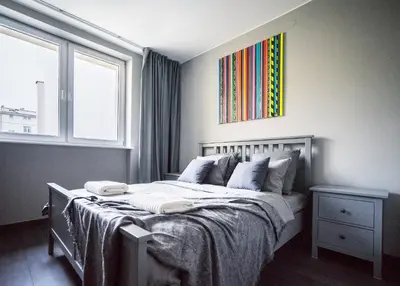 Łóżko lub łóżka w pokoju w obiekcie Grey House Warsaw