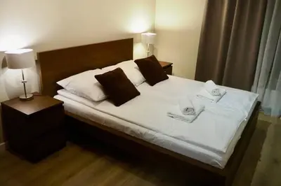 Łóżko lub łóżka w pokoju w obiekcie Sarmacka Apartment in Wilanów