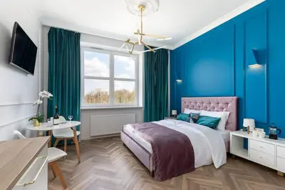 Łóżko lub łóżka w pokoju w obiekcie Gagarina 33 - Colorful Studio by Noclegi Renters