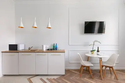 Telewizja i/lub zestaw kina domowego w obiekcie Gagarina 33 - Colorful Studio by Noclegi Renters