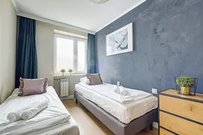 Łóżko lub łóżka w pokoju w obiekcie Plater Residence Apartments