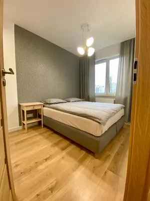 Łóżko lub łóżka w pokoju w obiekcie Comfortable apartments Warsaw West III
