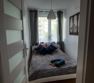 Łóżko lub łóżka w pokoju w obiekcie Apartament Iga