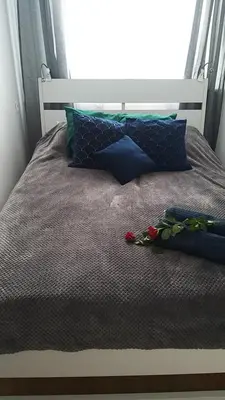 Łóżko lub łóżka w pokoju w obiekcie Apartament Iga