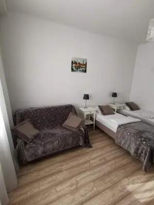 Łóżko lub łóżka w pokoju w obiekcie Studio Dymińska
