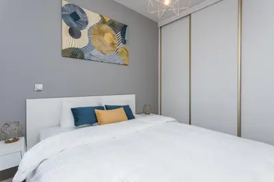 Łóżko lub łóżka w pokoju w obiekcie Chill Apartments Kolejowa