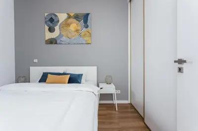 Łóżko lub łóżka w pokoju w obiekcie Chill Apartments Kolejowa