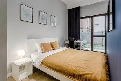 Łóżko lub łóżka w pokoju w obiekcie Warsaw City Apartments