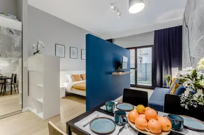 Łóżko lub łóżka w pokoju w obiekcie Warsaw City Apartments