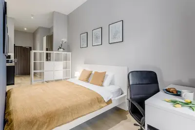 Łóżko lub łóżka w pokoju w obiekcie Warsaw City Apartments