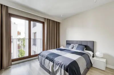 Łóżko lub łóżka w pokoju w obiekcie City Apartments Warsaw