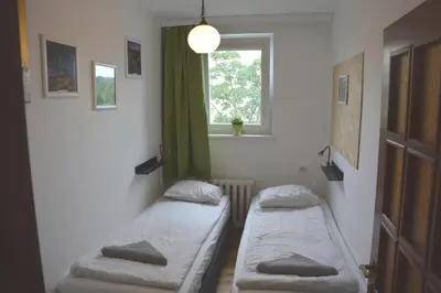 Łóżko lub łóżka w pokoju w obiekcie Labo Apartment Metro Wierzbno