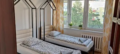 Łóżko lub łóżka w pokoju w obiekcie Labo Apartment Metro Wierzbno