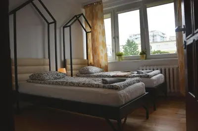 Łóżko lub łóżka w pokoju w obiekcie Labo Apartment Metro Wierzbno