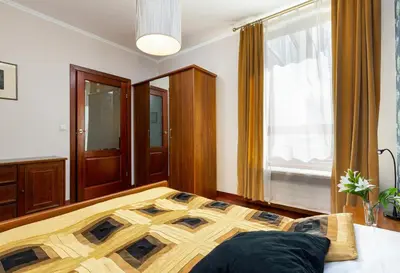 Łóżko lub łóżka w pokoju w obiekcie Apartments Mokotów Obrzeżna by Noclegi Renters