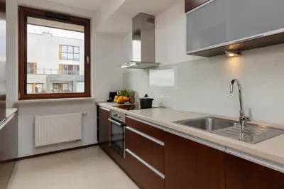 Kuchnia lub aneks kuchenny w obiekcie Apartments Mokotów Obrzeżna by Noclegi Renters