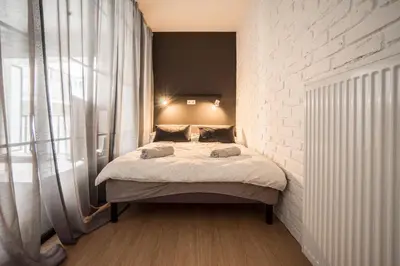 Łóżko lub łóżka w pokoju w obiekcie Mala 3 cozy apartment Old Town