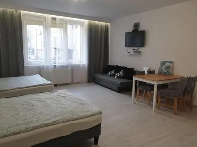 Łóżko lub łóżka w pokoju w obiekcie Apartamenty Smolna 11