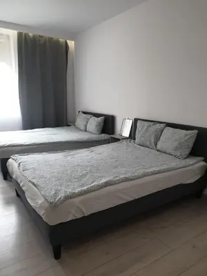 Łóżko lub łóżka w pokoju w obiekcie Apartamenty Smolna 11