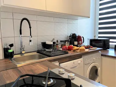 Kuchnia lub aneks kuchenny w obiekcie Apartament Centrum Chmielna 73c