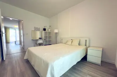 Łóżko lub łóżka w pokoju w obiekcie Vizja Apartments Kolska 9