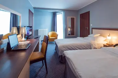 Łóżko lub łóżka w pokoju w obiekcie Poleczki Residence Apartments