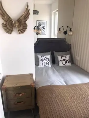 Łóżko lub łóżka w pokoju w obiekcie Luxury Wola Apartament