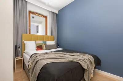 Łóżko lub łóżka w pokoju w obiekcie Karolkowa 28 II - Premium Apartments with Balcony by Noclegi Renters