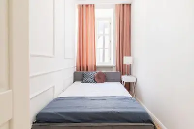 Łóżko lub łóżka w pokoju w obiekcie Apartamenty-MI Old Town Residence