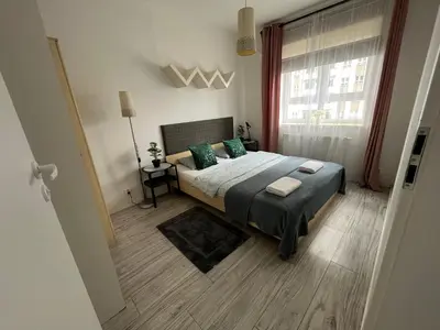 Łóżko lub łóżka w pokoju w obiekcie Apartament Stanczyka 2