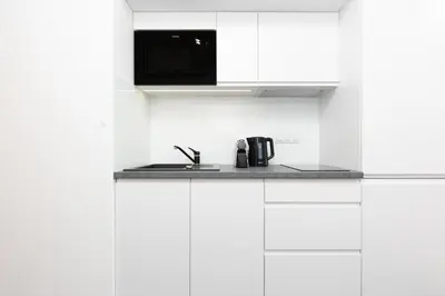 Kuchnia lub aneks kuchenny w obiekcie Elegancki Apartment z Parkingiem by Noclegi Renters