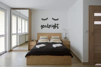 Łóżko lub łóżka w pokoju w obiekcie Flat Złote Tarasy Street