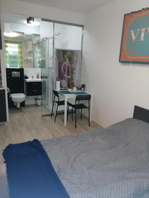 Łóżko lub łóżka w pokoju w obiekcie Apartamenty GALERIA PÓŁNOCNA
