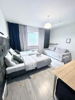 Łóżko lub łóżka w pokoju w obiekcie Pokoje i Apartamenty Willa Bielany