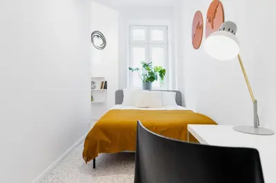 Łóżko lub łóżka w pokoju w obiekcie Warsaw Concierge Koneser