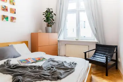 Łóżko lub łóżka w pokoju w obiekcie Warsaw Concierge Koneser