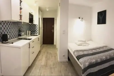 Łóżko lub łóżka w pokoju w obiekcie Apartamenty Centrum