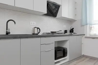 Kuchnia lub aneks kuchenny w obiekcie Kamienica Stanisława Augusta Warszawa by Noclegi Renters
